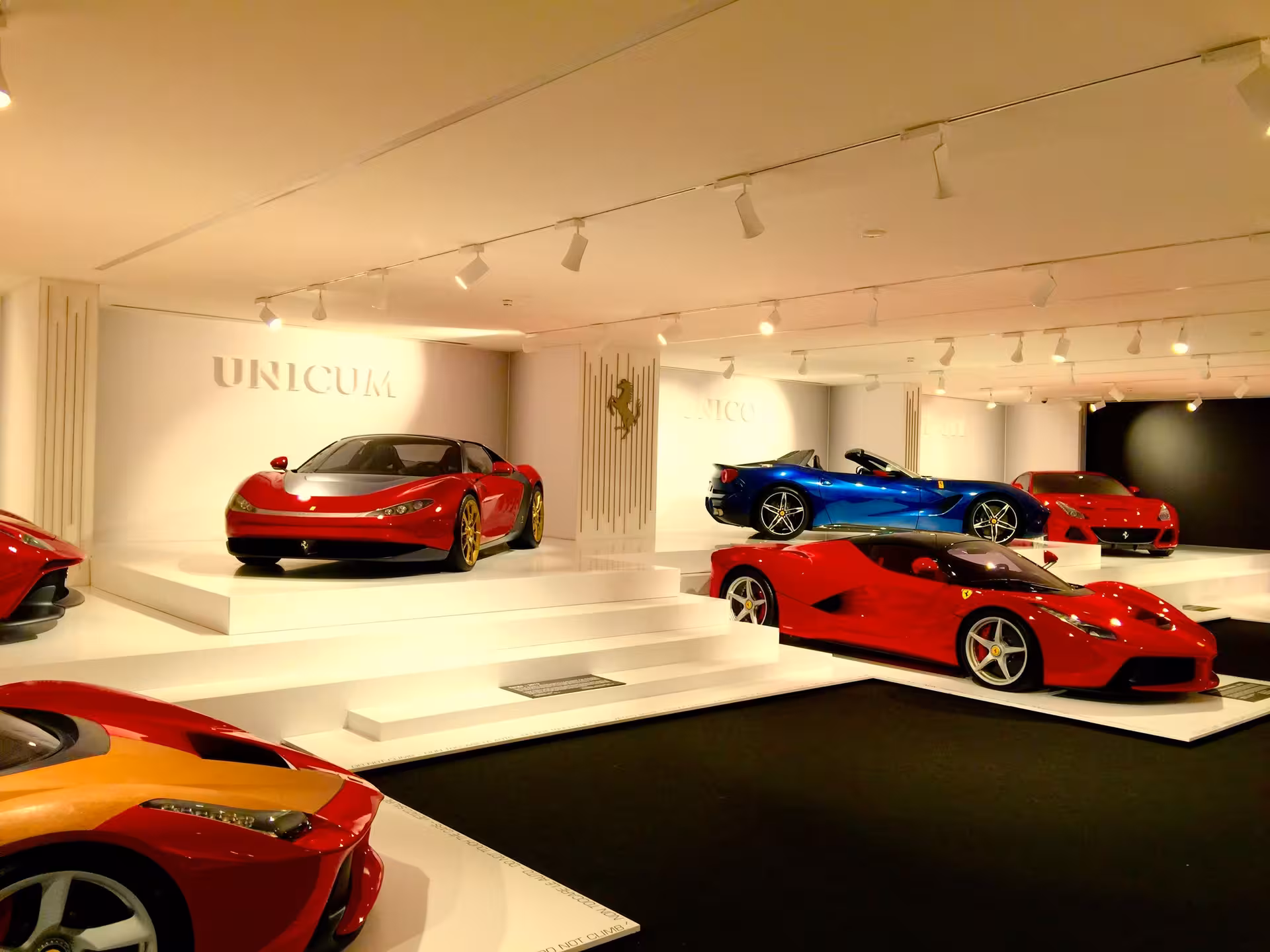 Luxury Ferrari supercars showcased in Maranello museum gallery, visit with Maranello Modena combo ticket and Mirabilandia