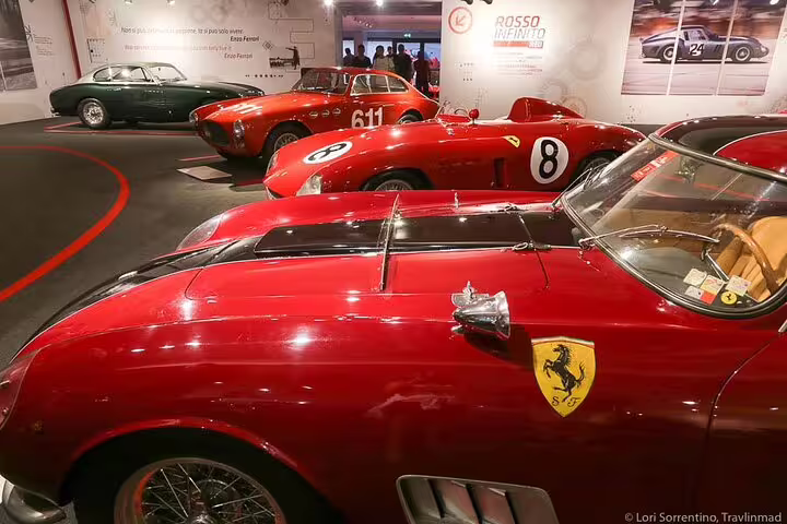Collection of classic red Ferrari sports cars showcased in the Ferrari Museum Modena on a private guided tour