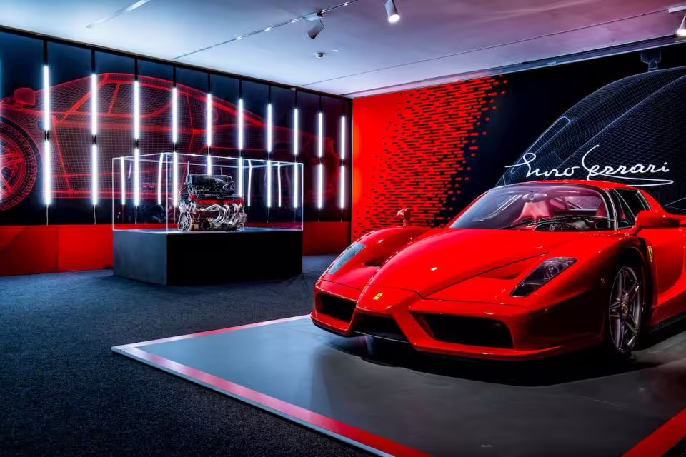 Red Ferrari supercar display at Enzo Ferrari Museum Modena, part of combo ticket for Maranello and Modena museums