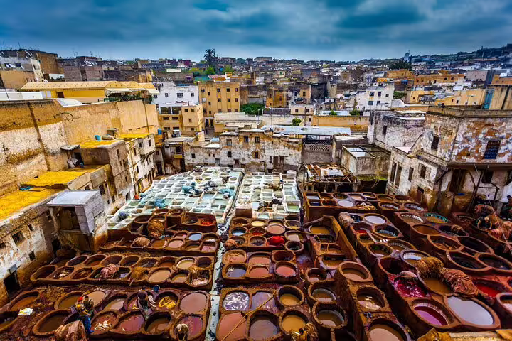 Fes Chouara tannery view with colorful dye vats, highlight stop on Morocco 12 days tour from Casablanca