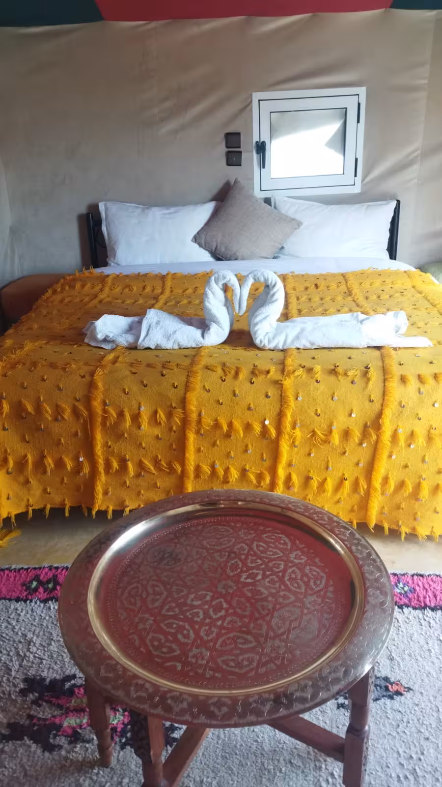 Inviting desert tent with decorative touches, offering a unique stay on the Fes to Errachdia desert tour.