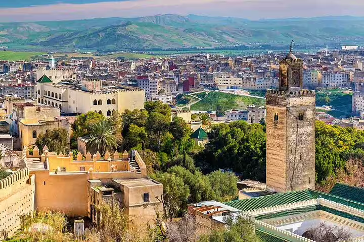 Panoramic view of Fes medina and historic minaret, cultural highlight on Morocco 9-day tour from Marrakech