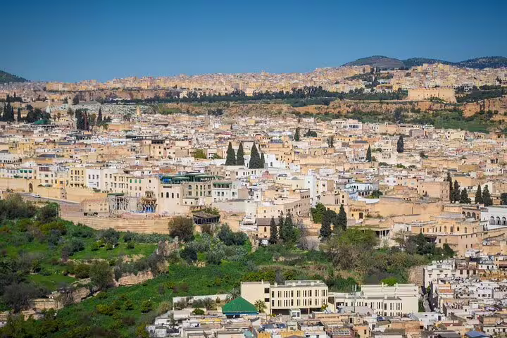 Panoramic view of Fes medina skyline and hills, iconic scene on Morocco 12 days tour from Casablanca