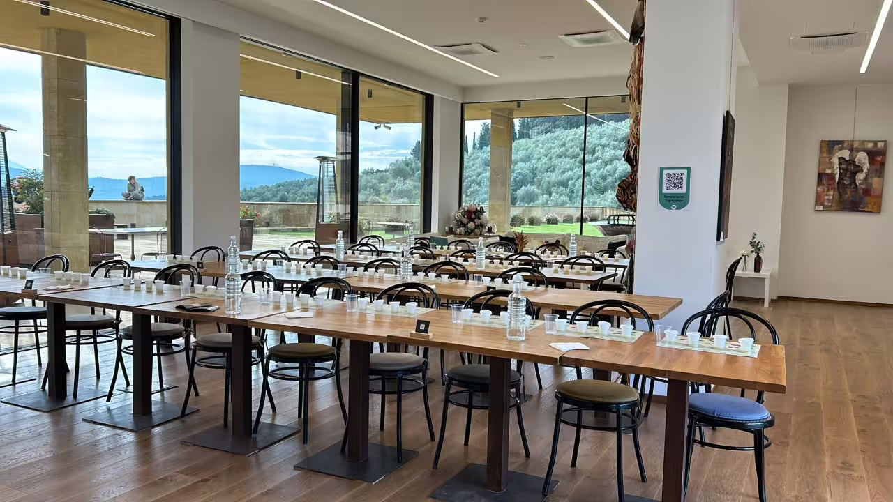 Bright tasting room at Frantoio Buonamici in Fiesole set for EVO olive oil Gold Experience with views