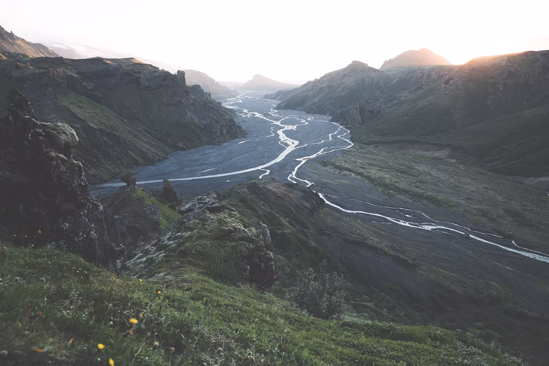 Braided glacial river winding through Fimmvörðuháls valley at sunset, Iceland highlands