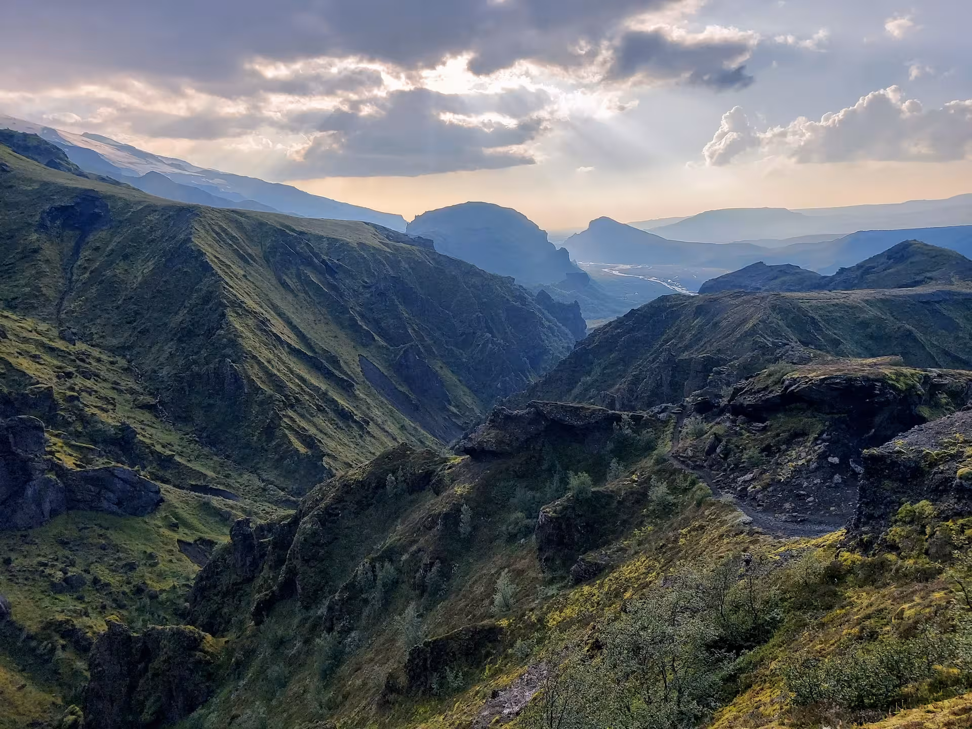 Dramatic green mountain valleys and rocky canyon on the Fimmvorduhals hike in Iceland