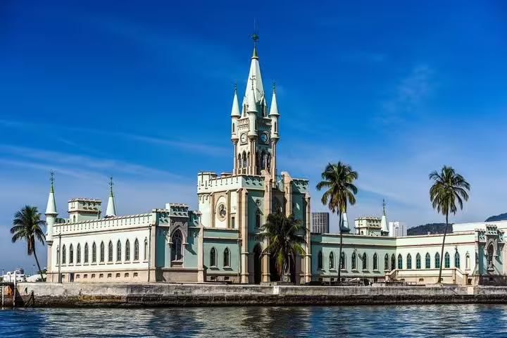 Stunning view of the neo-Gothic palace on Fiscal Island during the Brazil Imperial, Rio boat tour.