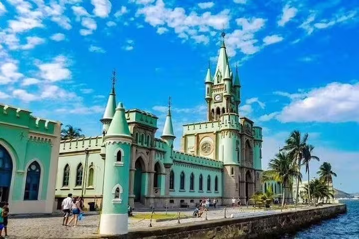 Explore the stunning neo-Gothic architecture of Fiscal Island's palace on the Brazil Imperial Rio boat tour.
