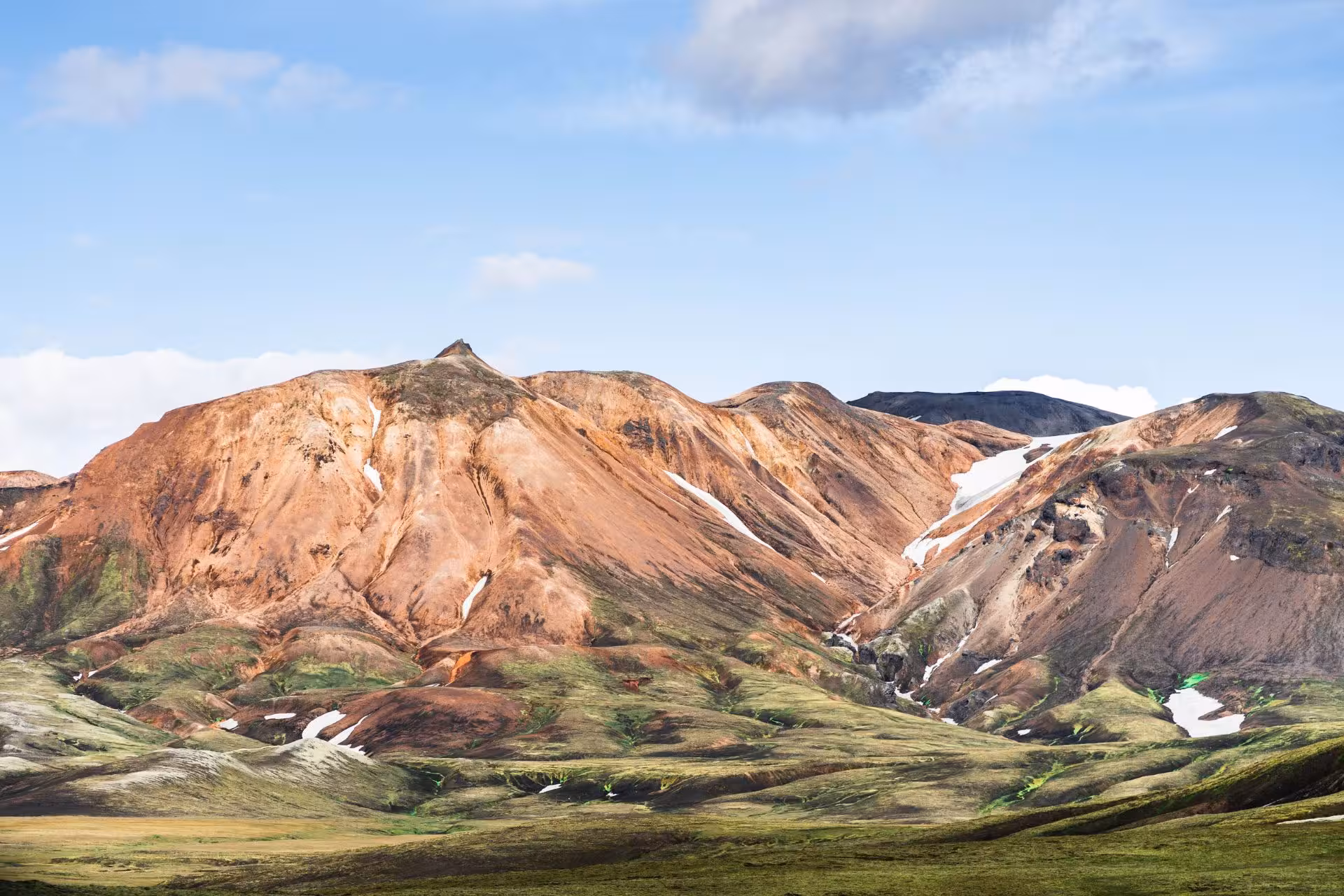 Colorful rhyolite mountains with snow patches in Fjallabak Nature Reserve, Iceland