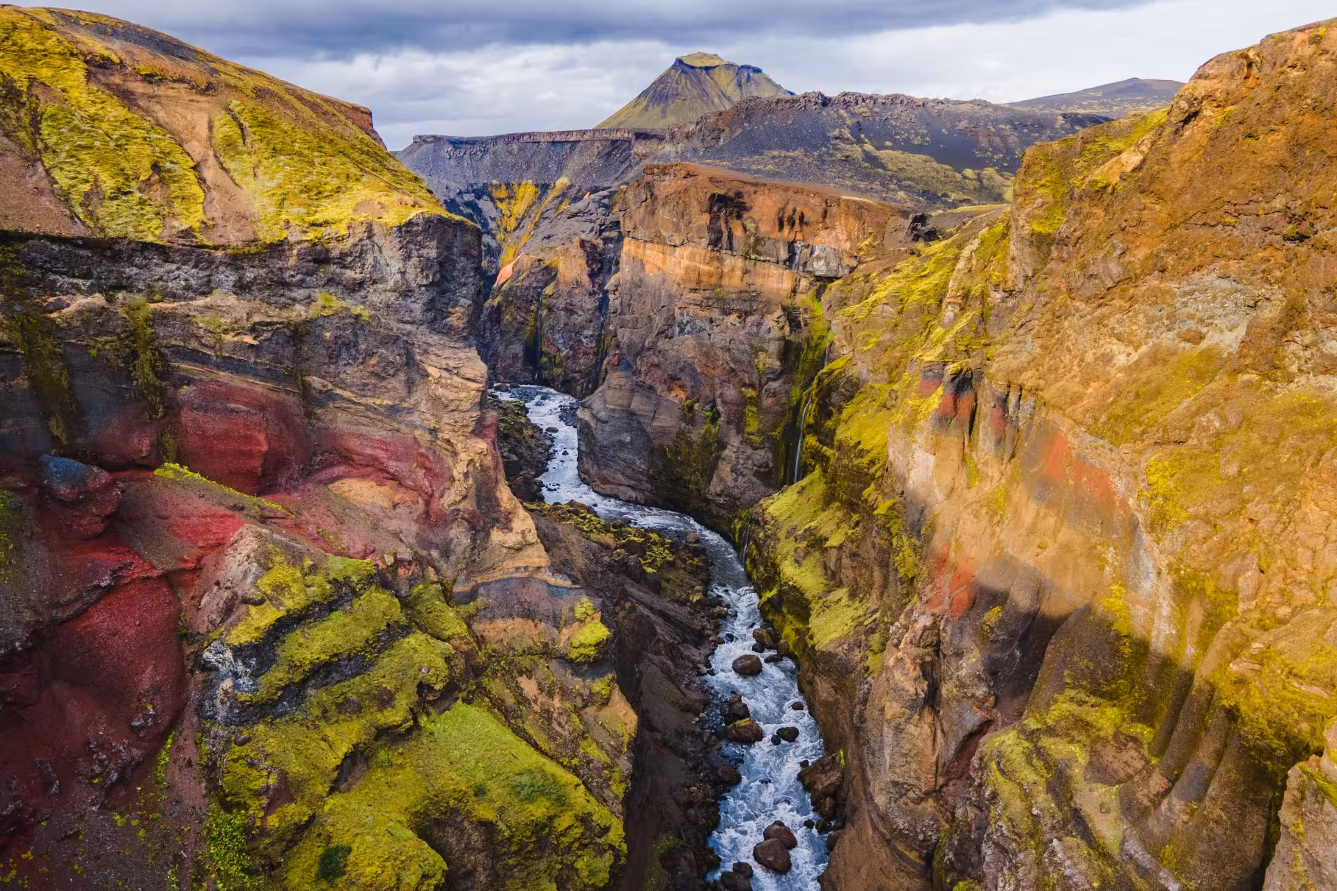 Colorful volcanic canyon with rushing river in Fjallabak Nature Reserve Iceland