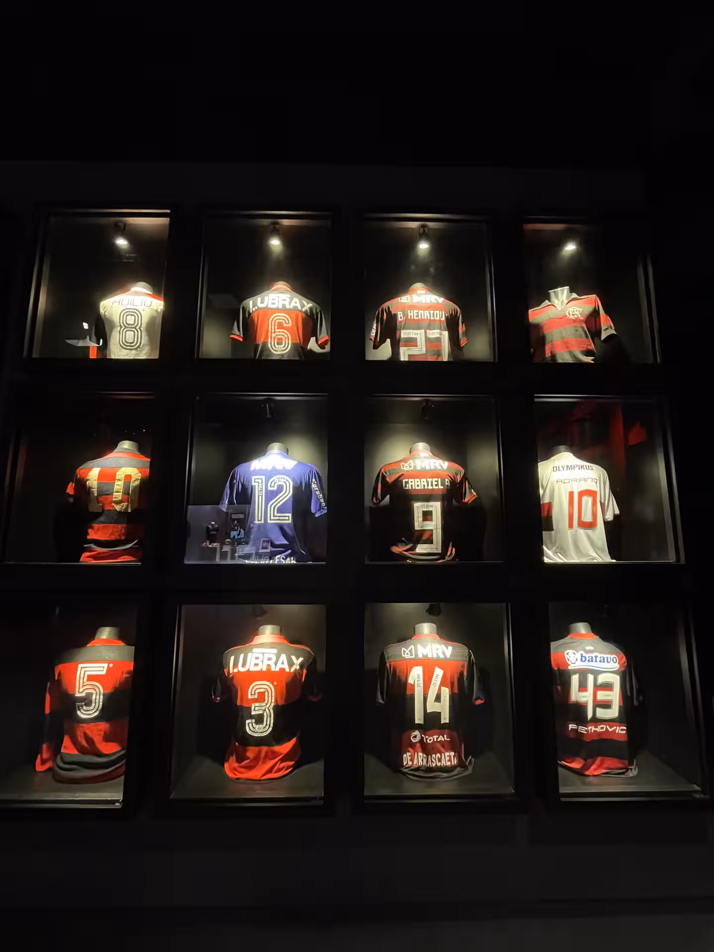 Collection of Flamengo jerseys showcased at Maracanã Stadium, featured in the Rio Football Experience tour.
