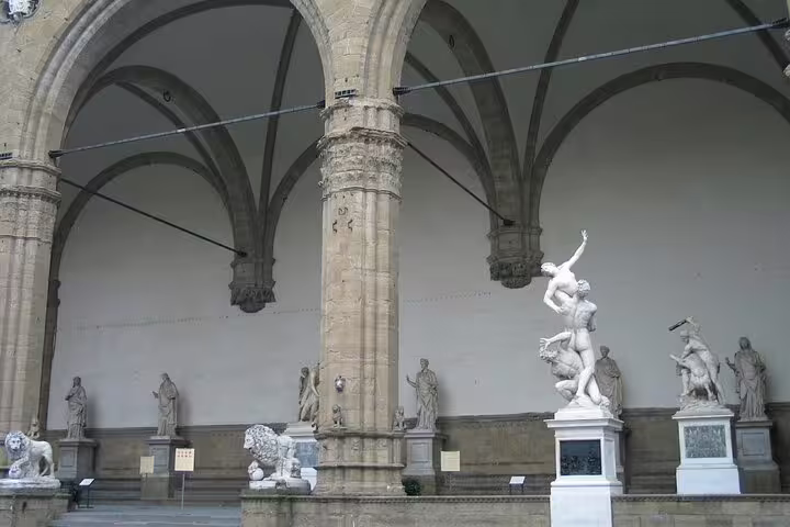 Renaissance statues in the open-air Loggia dei Lanzi near the Accademia Gallery, visited on a Florence small group walking tour