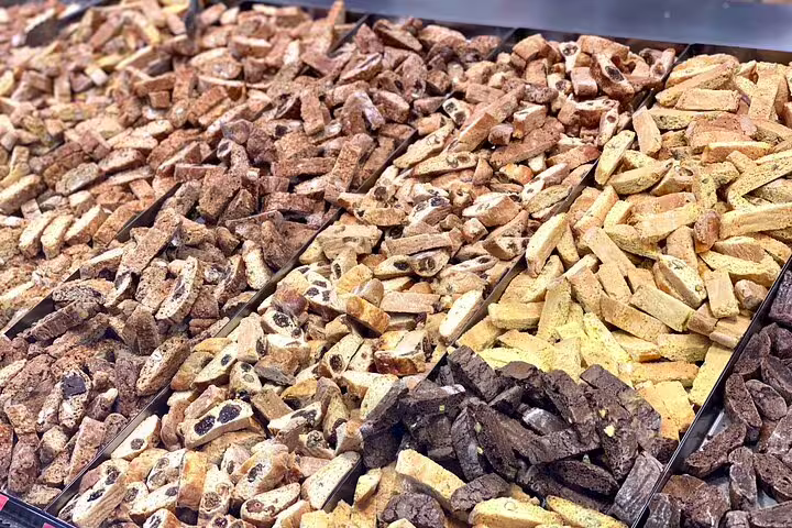 Assorted traditional Italian cantuccini biscotti varieties at a Florence market street food tasting tour stop