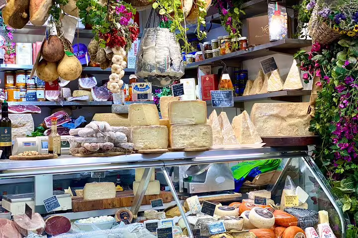 Vibrant Florence deli counter showcasing artisan cheeses, cured meats, and local Tuscan street food delicacies
