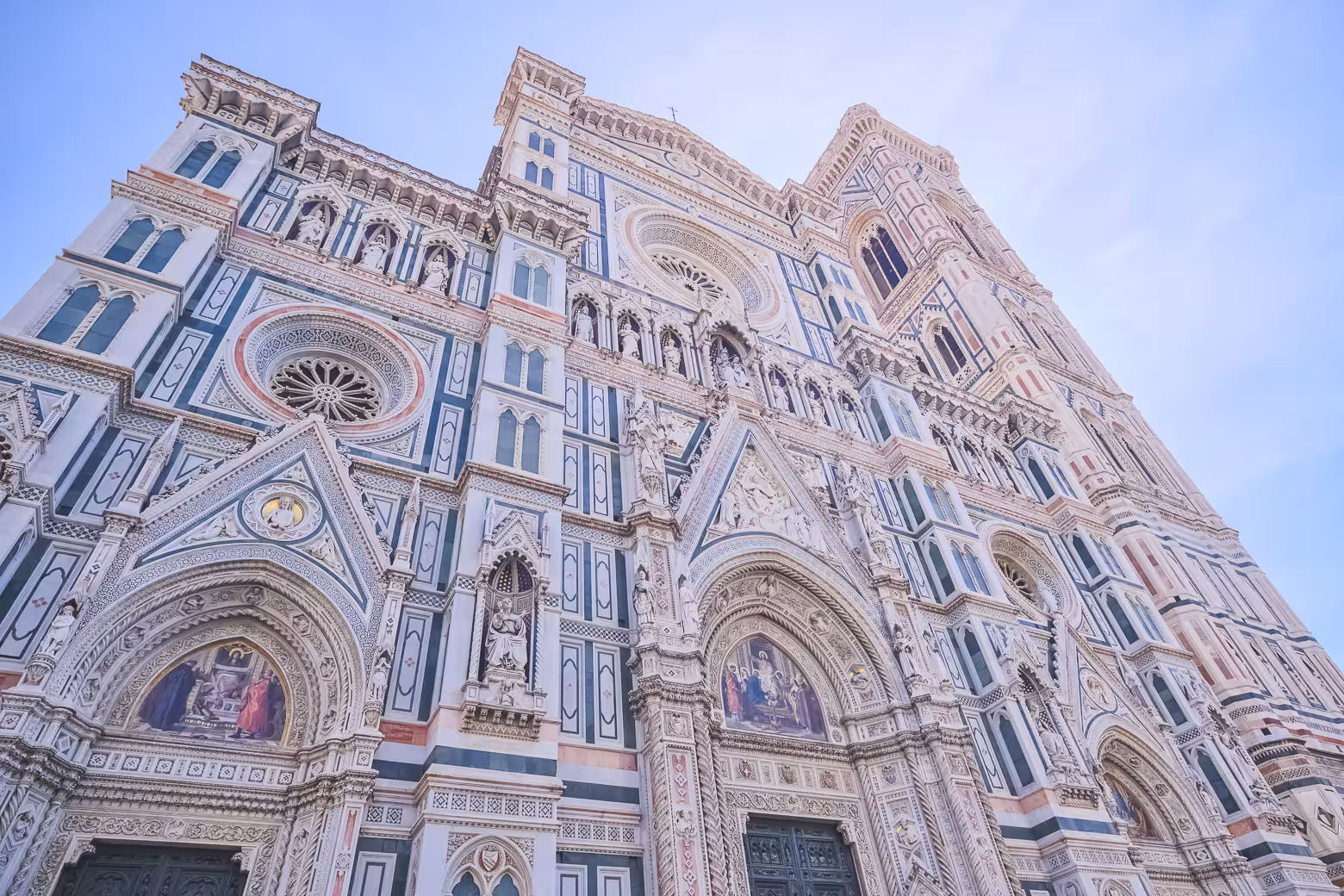 The intricate facade of Florence Duomo Cathedral, showcasing its Gothic architecture during a small group tour.