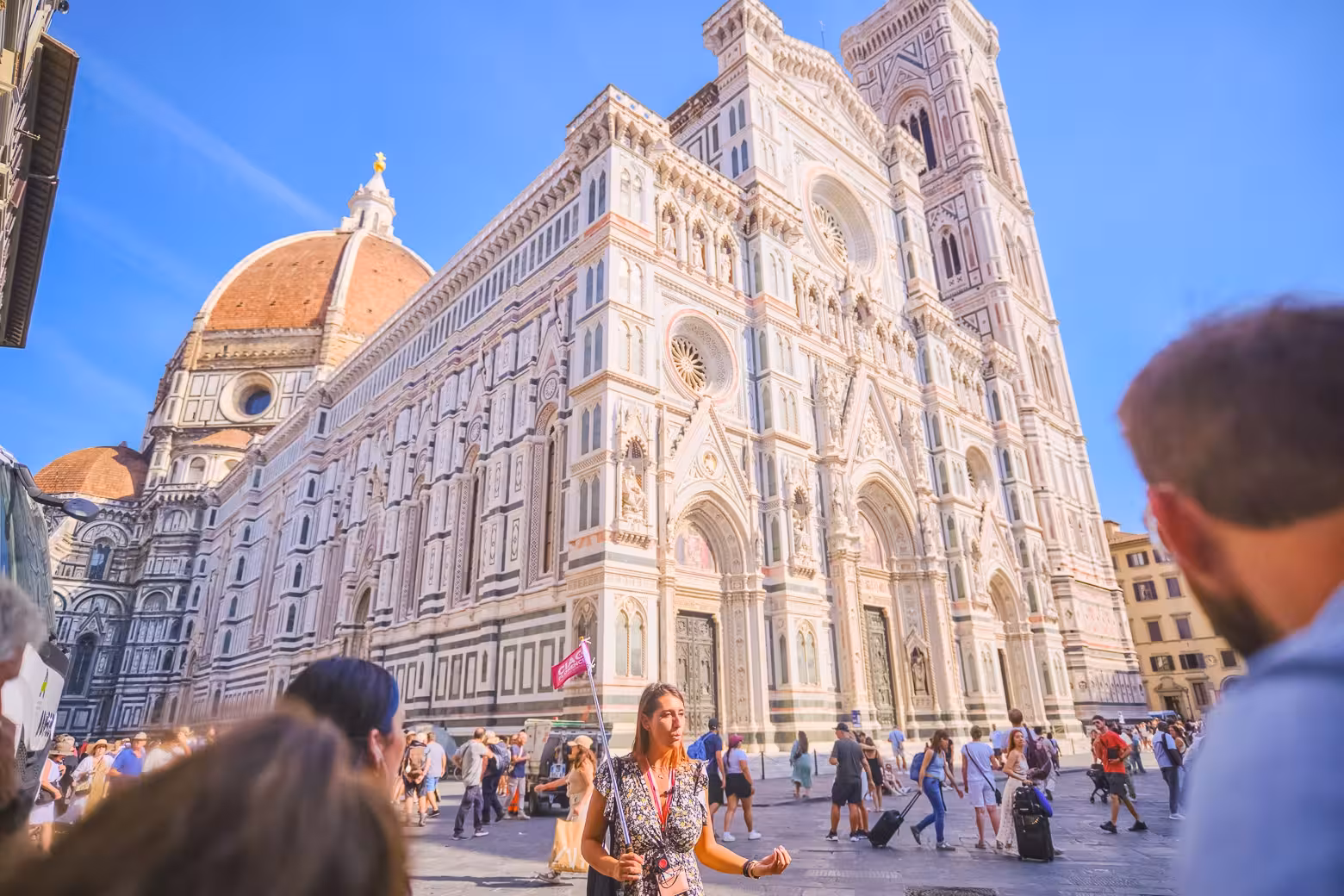 Visitors admire the stunning architecture of Florence's Duomo, a highlight of the Duomo Complex and Hidden Terraces tour.