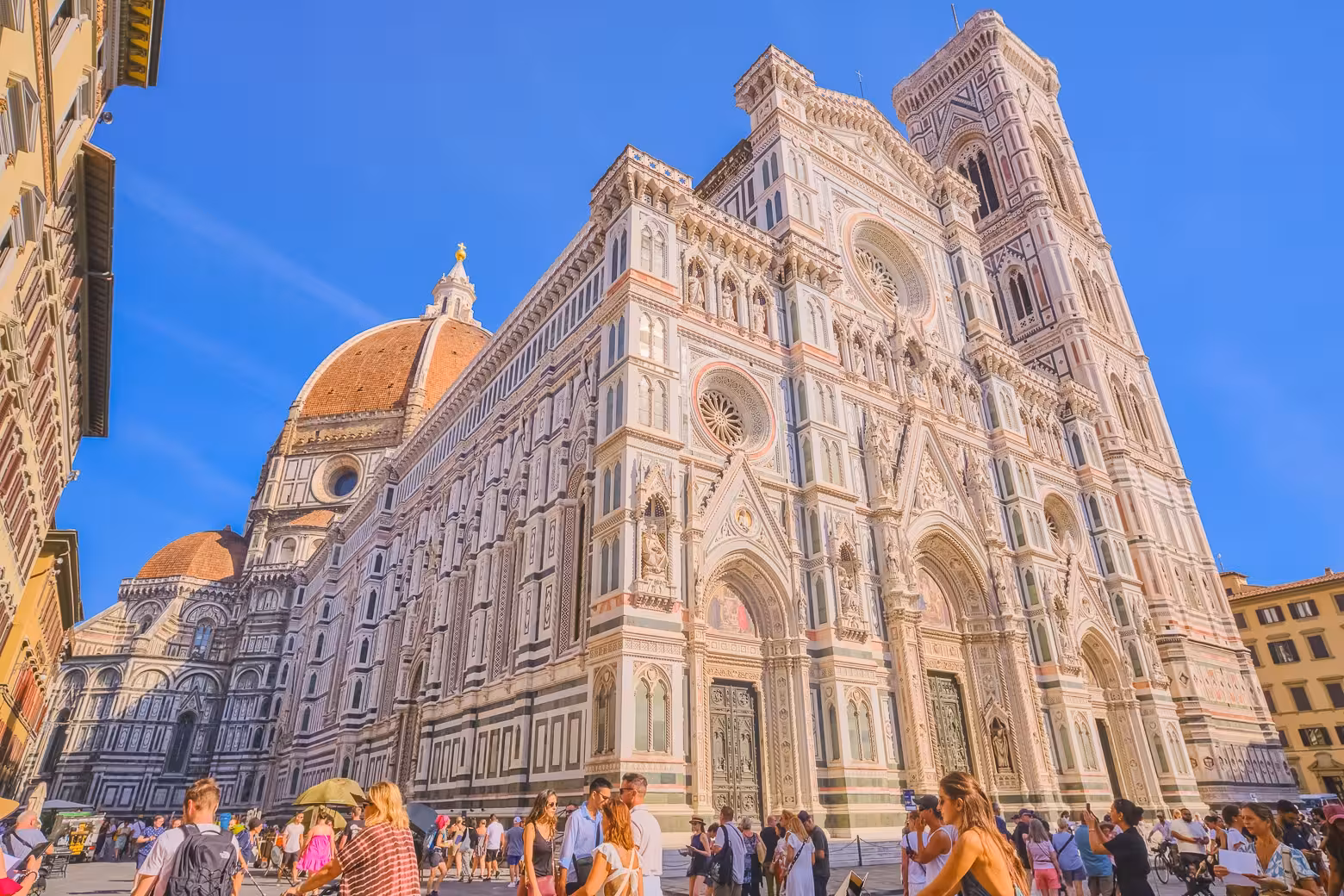 Visitors admire the stunning facade of Florence's Duomo, a key highlight of the must-see Duomo Complex tour.