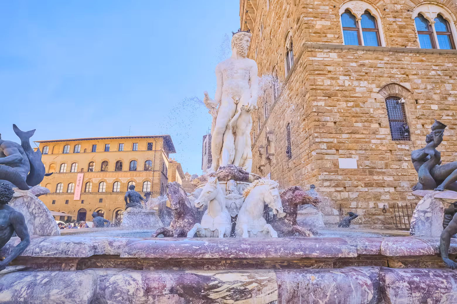 Explore the historic Neptune Fountain in Florence's Piazza della Signoria during a guided shore excursion from Livorno.