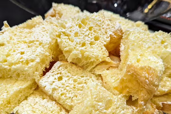 Close-up of freshly baked focaccia pieces served as a tasting stop on a guided Verona food tour