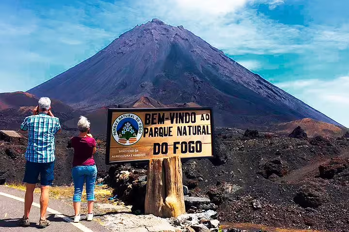 Visitors capturing the majestic Fogo Volcano at Parque Natural do Fogo, a highlight of the guided tour from São Filipe.