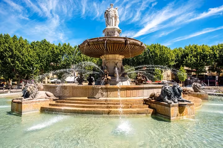 Ornate Fontaine de la Rotonde with lion sculptures and cascading water in Aix-en-Provence, France