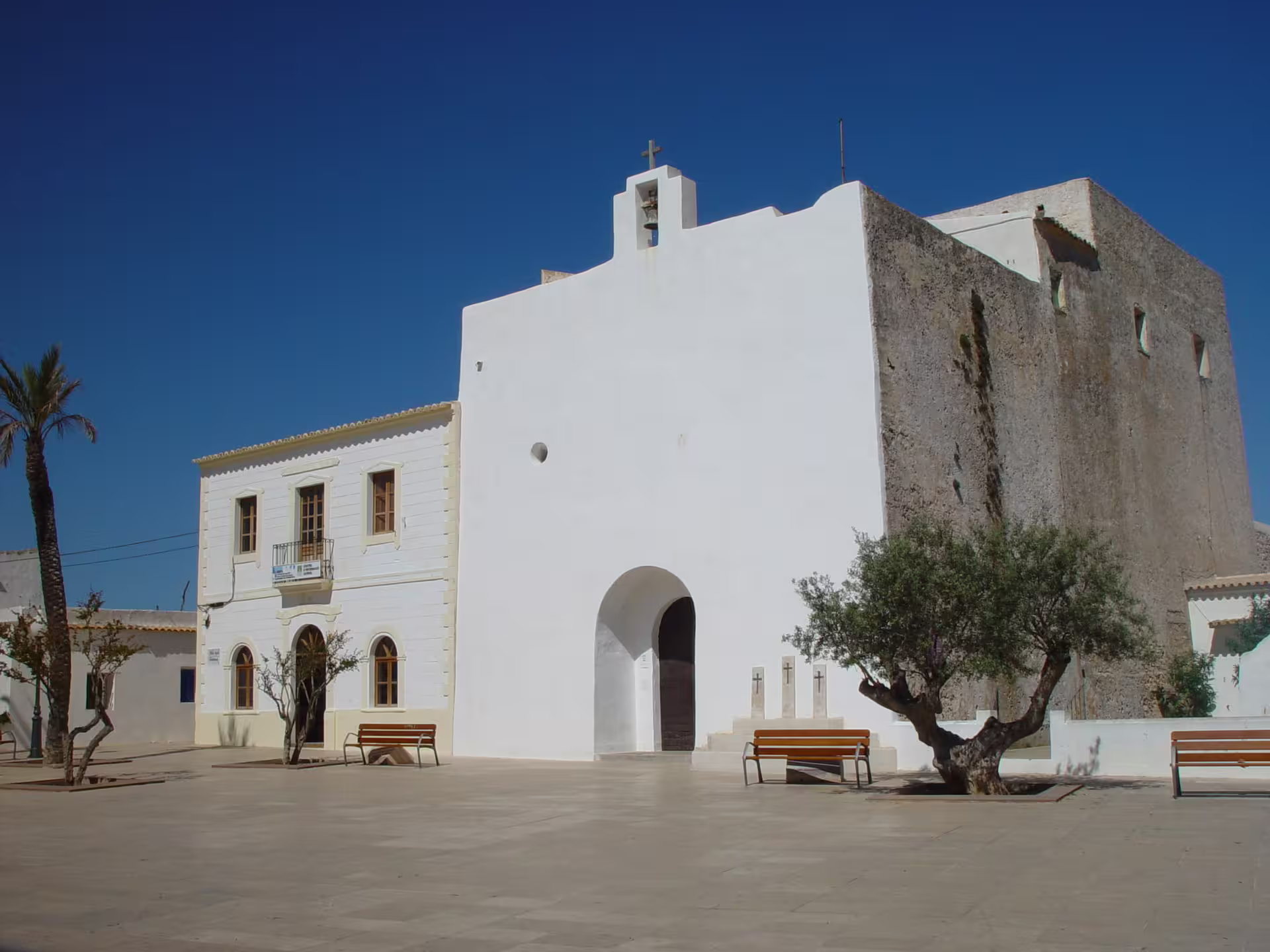 Whitewashed Formentera church and plaza stop on Ibiza day trip to Formentera by bike with ferry and transfer