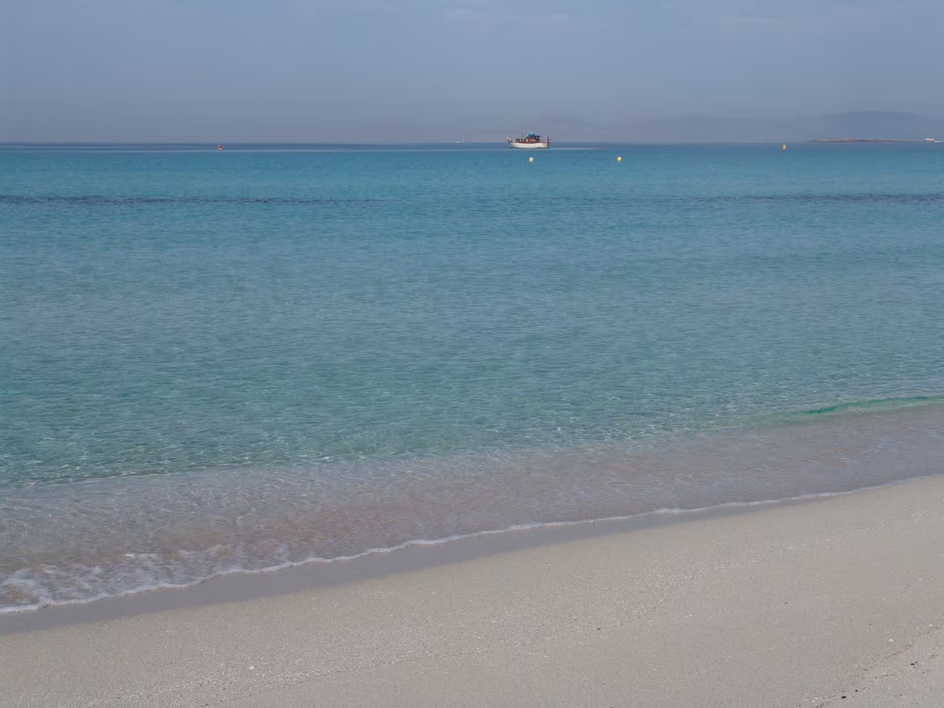 Turquoise Formentera sea and white sand beach, perfect stop on Ibiza to Formentera fast ferry day trip