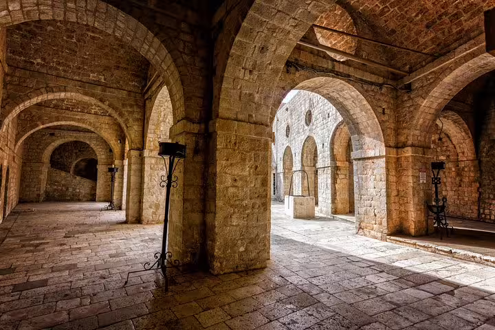 Arched stone corridor inside Fort Lovrijenac, Dubrovnik Game of Thrones filming site on guided group tour