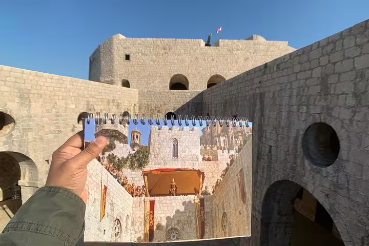 Fort Lovrijenac courtyard shown with storyboard on King’s Landing streets group tour in Dubrovnik, GOT filming site