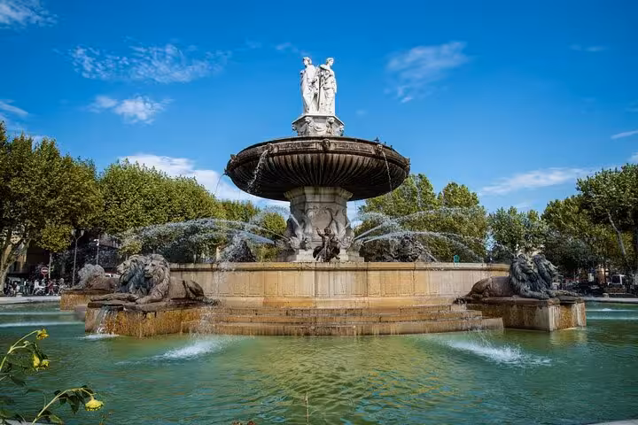 Fountain of La Rotonde in Aix-en-Provence with statues and flowing water, a highlight of the private walking tour.