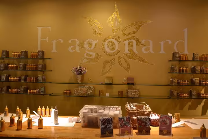 Fragonard perfume shop interior with golden decor and shelves of fragrances in French Riviera