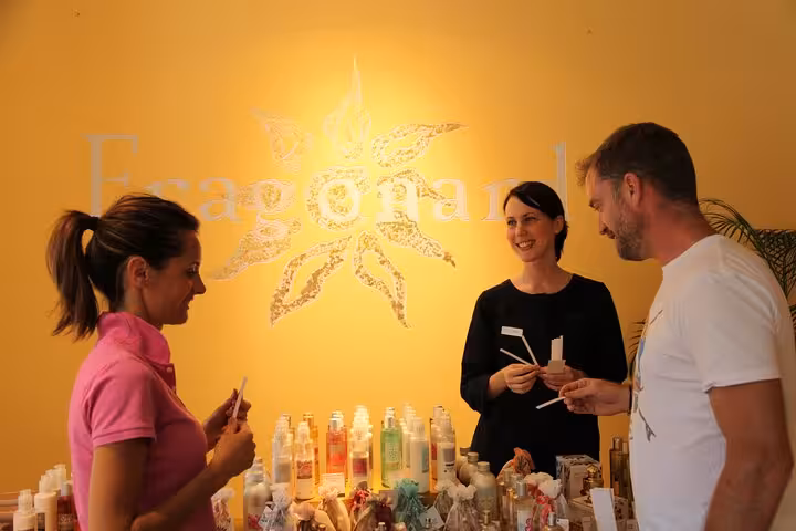 Visitors sampling perfumes at Fragonard boutique on French Riviera countryside tour