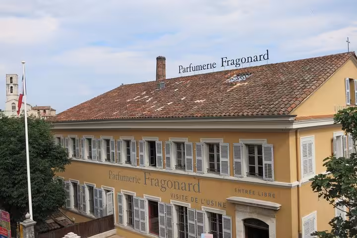 Parfumerie Fragonard yellow building with shuttered windows in Grasse, French Riviera countryside