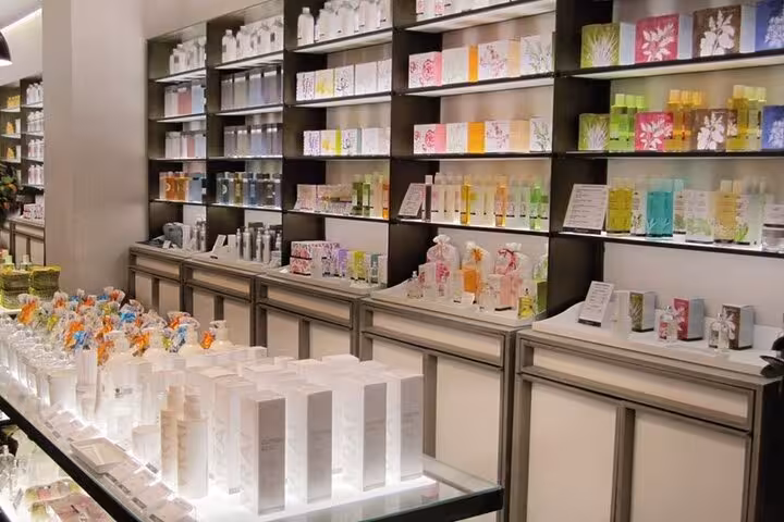 Interior of Fragonard store displaying colorful perfume and soap products, highlighting Provencal craftsmanship and scents.