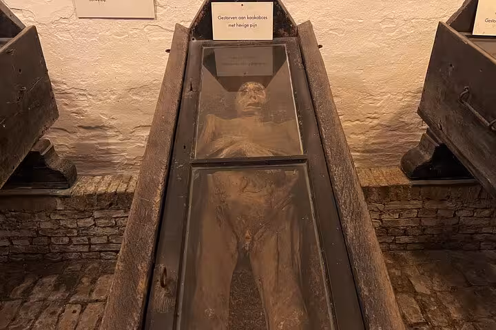 Historic mummified body display at Museum in Franeker, a quirky hidden gem stop from Amsterdam tour