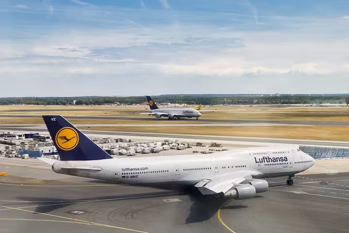 Lufthansa Boeing 747 aircraft on Frankfurt Airport tarmac with second plane taxiing in background