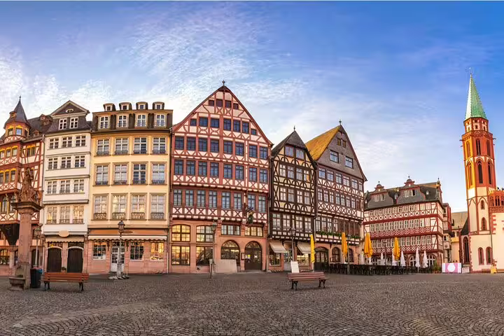 Half-timbered buildings and church tower at Römerberg square in Frankfurt Old Town