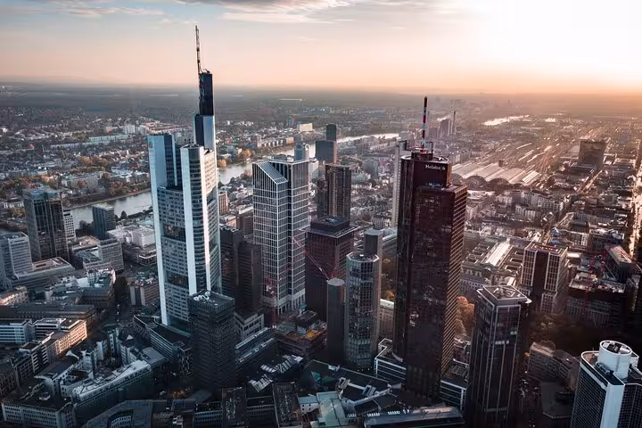 Aerial view of Frankfurt skyline with skyscrapers and River Main at sunset