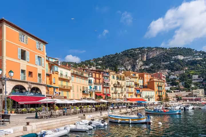 Colorful waterfront buildings and boats in Villefranche-sur-Mer harbor on the French Riviera