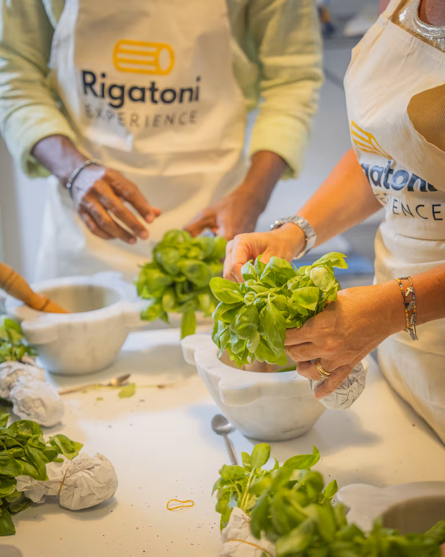 Close-up of fresh basil preparation during a pesto-making class in the Portofino and Cinque Terre region.