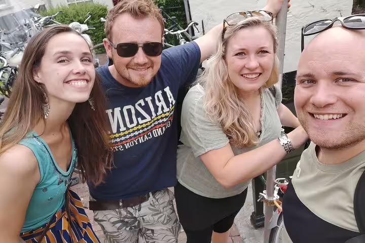 Group of friends on an e-scavenger hunt in Milan, solving outdoor puzzles and exploring landmarks together