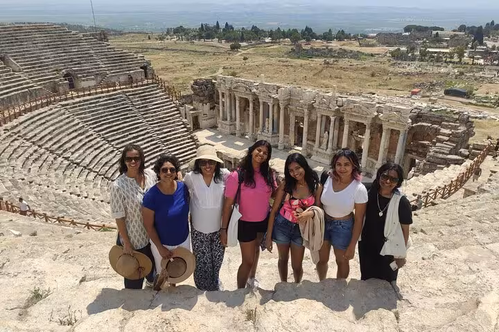 Friends at Hierapolis theater ruins on a private Pamukkale day tour with Denizli Airport transfer