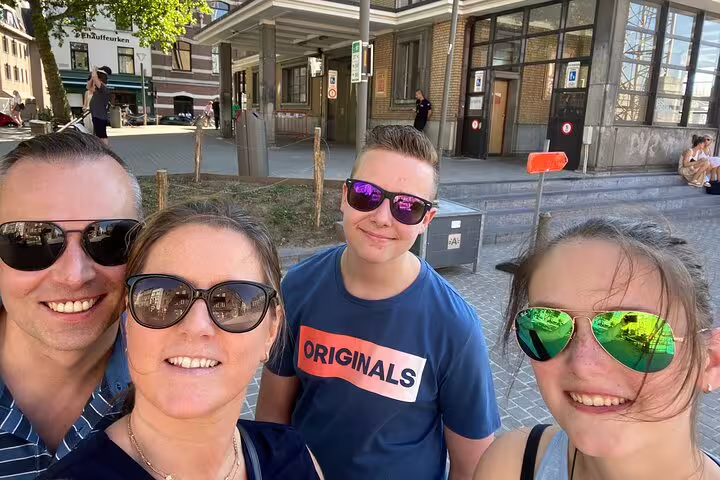 Friends taking a selfie during a self-paced e-Scavenger hunt in Cognac, France, exploring city landmarks