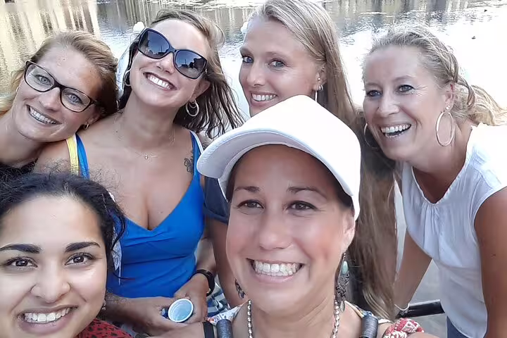 Friends taking a selfie by the water during an e-scavenger hunt in Marseille, exploring at their own pace