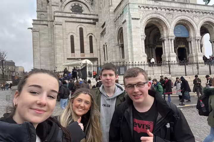 Friends selfie at Sacré-Cœur Basilica, Montmartre, during a Paris self-guided scavenger hunt tour