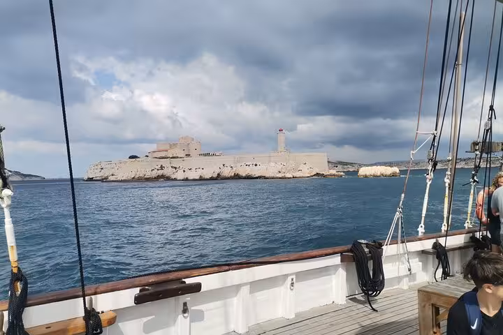 View of Frioul Islands fortress from the boat on a Blue Coast coves cruise, Marseille calanques sea excursion