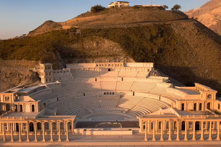 Majestic outdoor amphitheater in Fujairah nestled against a hillside, showcasing stunning architectural beauty.