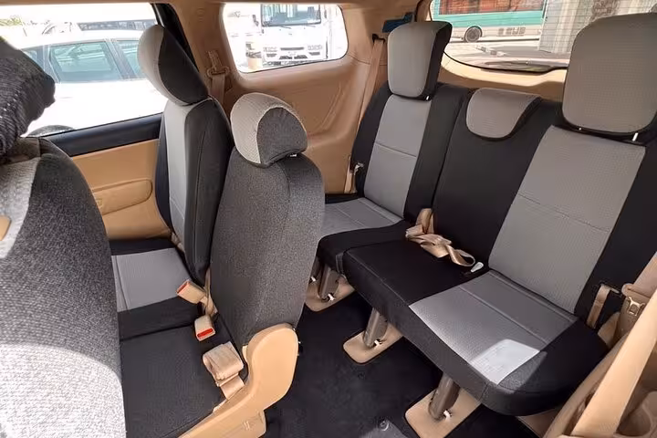 Spacious minivan interior with comfortable seats for Fujairah Dibba Khorfakan to Dubai Airports transfer