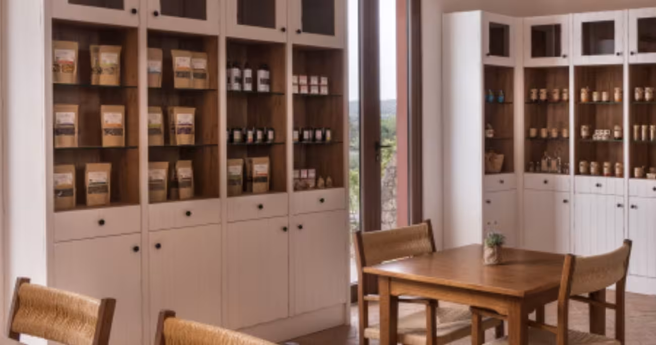 Cozy farm shop with wooden shelves of local products, a sunlit tasting table and countryside views on full day buggy tour stop