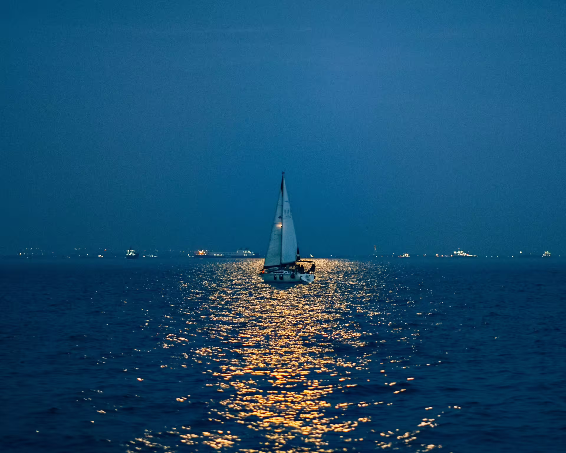 cover image of the 2.5h Full Moon sailing experience in Sotogrande Boat floating above the flash and unfurling sails